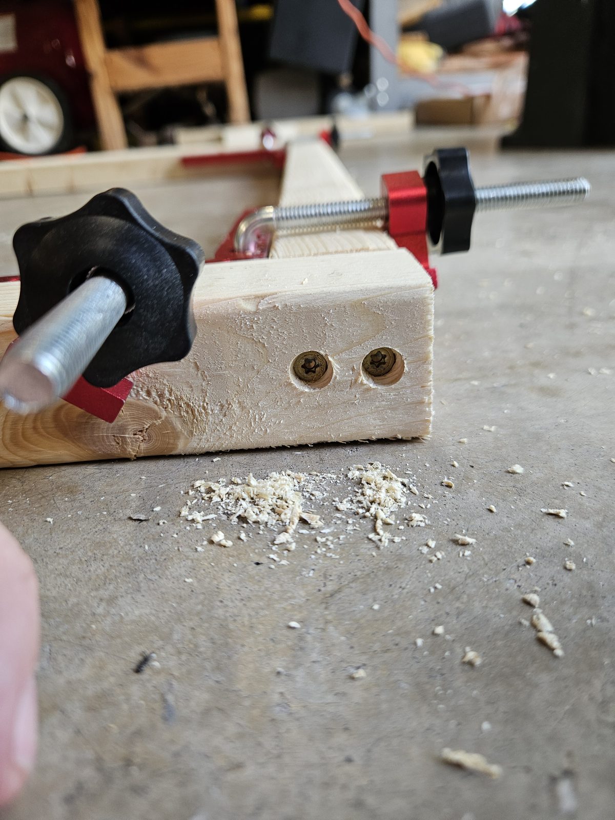 Two countersunk SPAX screws driven through the end rail into the end of the side rail